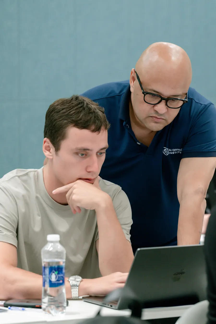 Dave coaching a student one-on-one at their laptop